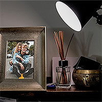 Photo effect - Bronze photo frame under the light of a lamp