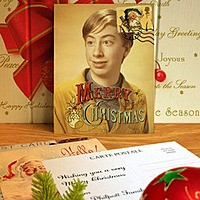 Photo effect - Vintage Christmas postcard on the table