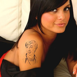 Photo effect - Tattoo on the arm of charming girl