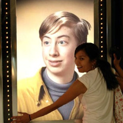 Photo effect - Girl in front of playbill with you