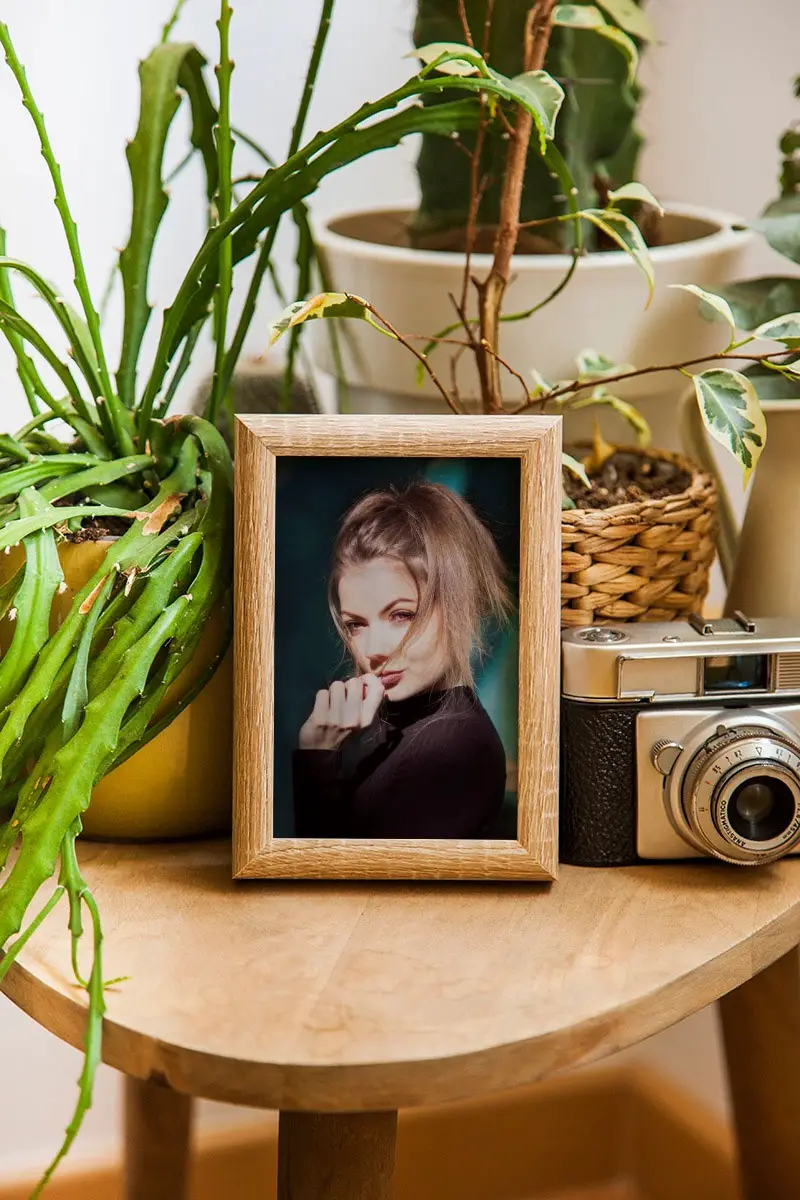 Photo effect - Wooden photo frame on the wooden table